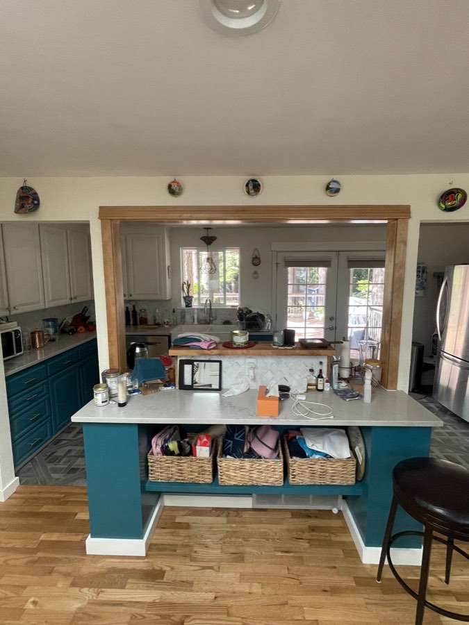 The kitchen island after the work, in deep teal with a new counter